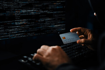 Cropped hands image in criminal anonymous male approaching credit card of personal information...