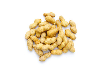 Roasted peanuts in shell on white background.