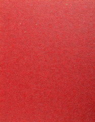 Fototapeta premium Close-Up of Textured Red Paper Background for Design, Craft Projects, and Creative Backdrops. New Year Christmas Holiday Gift Packaging Craft. Vertical Banner Wallpaper Background With Copy Space