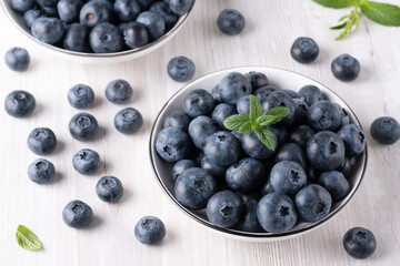 Fresh blueberries on a wooden white table