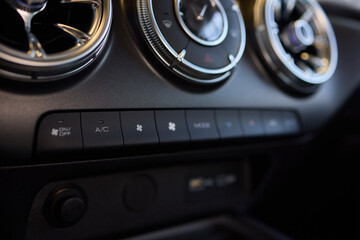 Fototapeta premium Closeup of car dashboard air vents near gear shift