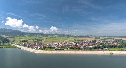 Summer skyline cityscape of Frydman village at Czorsztyn lake (Jezioro Czorsztyńskie) in Lesser Poland (Małopolska), Poland. Wide panoramic aerial view © uslatar