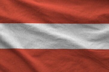 Austria flag depicted on folded wavy fabric of old cloth close up