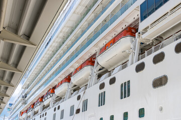 Life boats on a white cruise liner , close up view.