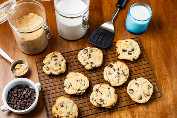 Fresh baked Chocolate Chip Cookies on cooling rack, flat lay, background.