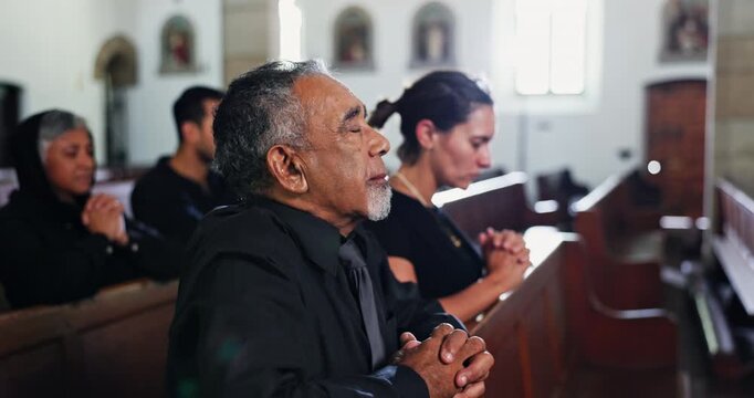 Church, funeral and people praying in memorial, service and ceremony in religion for death and mourning loss. Christian, crowd and sad congregation thinking of memory or respect prayer in chapel