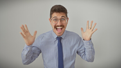 Excited hispanic man with moustache smiling in striped shirt and tie against white