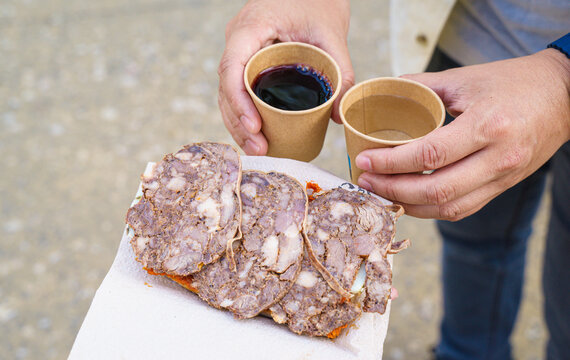 Sobrassada in Catalan, or sobrasada in Spanish, a raw, cured sausage from the Balearic Islands made with ground pork, paprika, salt, spices. Top with tomato sauce. Eat with bread, pair with wine