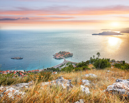 Captivating sunset view of Adriatic coast and islet Sveti Stefan from church st. Sava viewpoint near Budwa