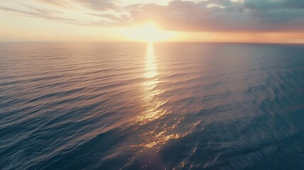 Obraz premium Witness the ethereal blend of sea and sky at sunset from a mesmerizing aerial perspective captured by a drones lens Flight over the ocean Ocean loop video background : Generative AI