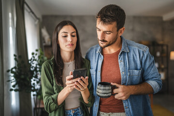 Portrait of girlfriend show mobile phone screen to her boyfriend