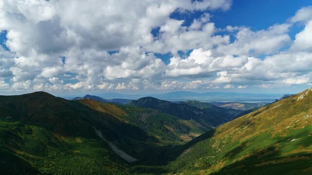 Timelapse of Tatra mountains landscape valley in summer daytime with clouds
