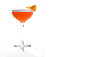 orange alcoholic drink in a cocktail glass