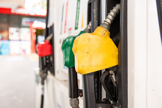 close up of petrol pumps hung up ready to use