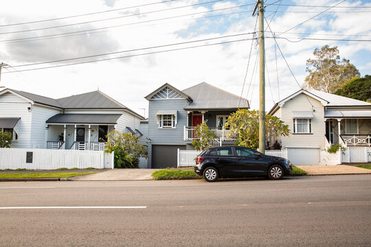 row of historical cottages on a suburban street in Brisbane