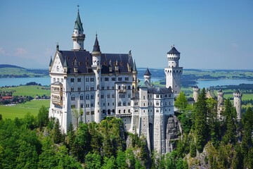 Fairytale Castle Amidst Lush Forests and a Calm Lake