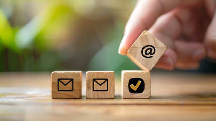 Hand putting wooden block cube symbol telephone, email, address. Website page contact us or e-mail marketing concept
