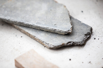 Cement tiles on a white background. Selective focus.
