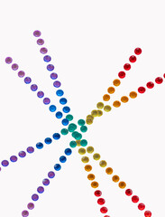 Straight lines of faux rhinestones or gems crisscross making an abstract isolated design. Jewelry beads sparkle & are all colors with facets. They look like round dots.