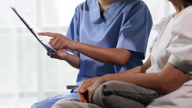 Elderly patient receiving personalized healthcare consultation at home. Healthcare professional discussing with an elderly patient at home, providing personalized care.