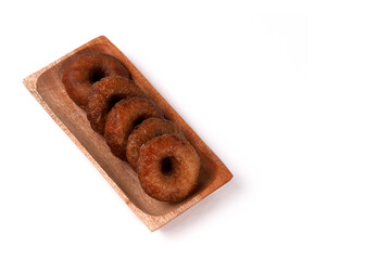 Kue Cincin often called Donut Cake, or Ali Agrem is a cake that is served as a daily snack. It is made from brown sugar mixed with rice flour, on wooden plate