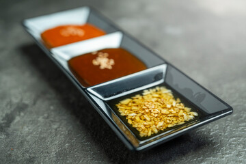A meat and onion salad is served on a leafy green lettuce