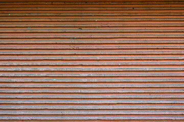 The image is of a brick wall with a brown and white color scheme