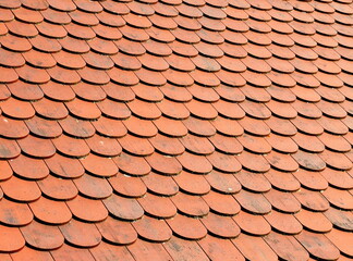 red round tiles on the roof, traditional red roof, close up and details