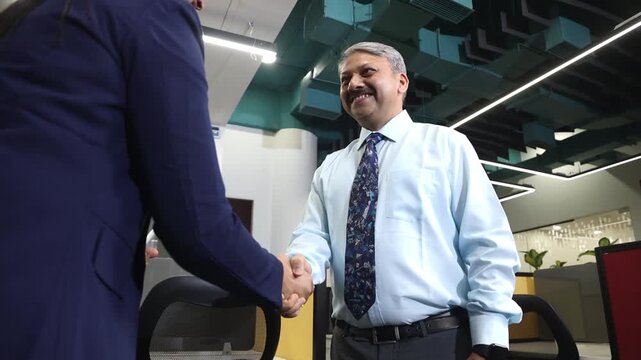 Young Indian woman shake hand company boss hr manager after successful job interview, Deal done, Career and opportunities, hiring best candidate for job, Recruitment.
