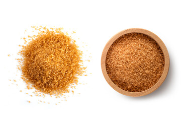 Brown sugar cane in wooden bowl isolated on white background. Top view