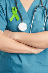 Doctor with green Ribbon for world Lymphoma Awareness September month, world Mental Health Day,...