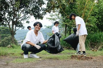 Young Environmental Activist Picking Up Plastic To Trash Bag. Save The World, Earth Day.