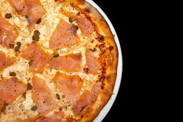 Salmon pizza in black background