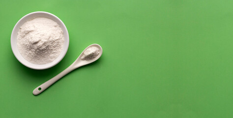 Baking soda powder in spoon and bowl - Healthy food