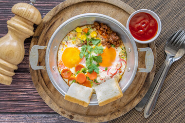  Indochina Omelette Asian street food in hot pan.