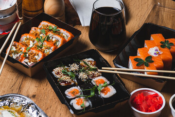 Sushi and rolls in delivery boxes