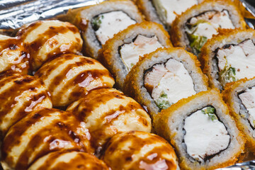 Sushi and rolls in delivery boxes