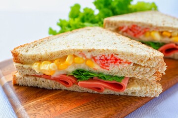Homemade ham with sweet corn  sandwich in black plate on white background