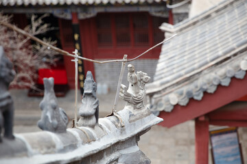 The immortals riding animals on the brackets of traditional Chinese buildings