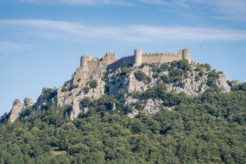 Summer landscape view of historic medieval Puilaurens cathar castle ruin on top of rocky mountain, Lapradelle-Puilaurens, Aude, France