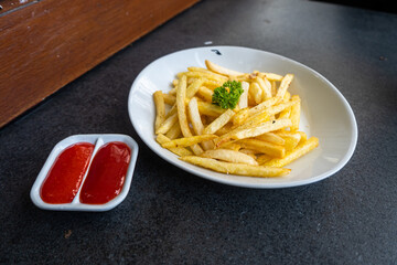 fried french fries on a white plate