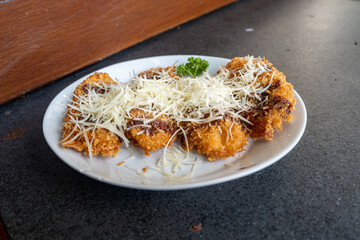sweet fried bananas topped with chocolate and cheese