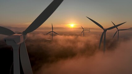 Wind energy plant at sunrise, clean and renewable power concept.