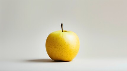 A crisp, juicy, golden apple isolated on a white background. The perfect image for a healthy lifestyle blog or a food magazine.