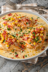 Creamy Chicken Corn and bacon closeup on the plate on the table. Vertical