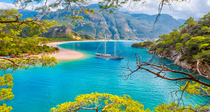 Blue gulet anchored at the Aegean sea - Panoramic view of Oludeniz Beach And Blue Lagoon, Oludeniz beach is best beaches in Turkey - Fethiye, Turkey