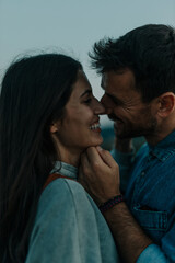 Close up shot of young couple in love standing together outdoors and kissing © La Famiglia