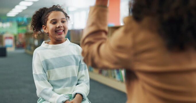 High five, child and teacher in school, questions and celebration for preparation of test, girl and education. Library, hands and tutor with kid for learning of literature for exam, smile or together