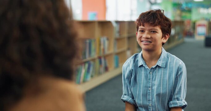 High five, child and teacher in library, education and celebration for preparation of test, boy and smile. School, hands and tutor with kid for learning of literature for exam, happy and together