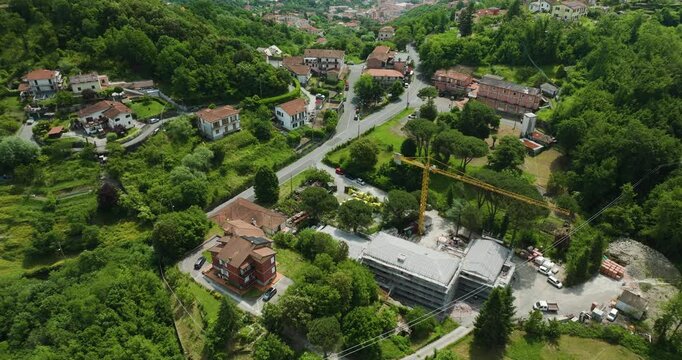 A construction site in the lush green hills of foce la spezia, italy, aerial view